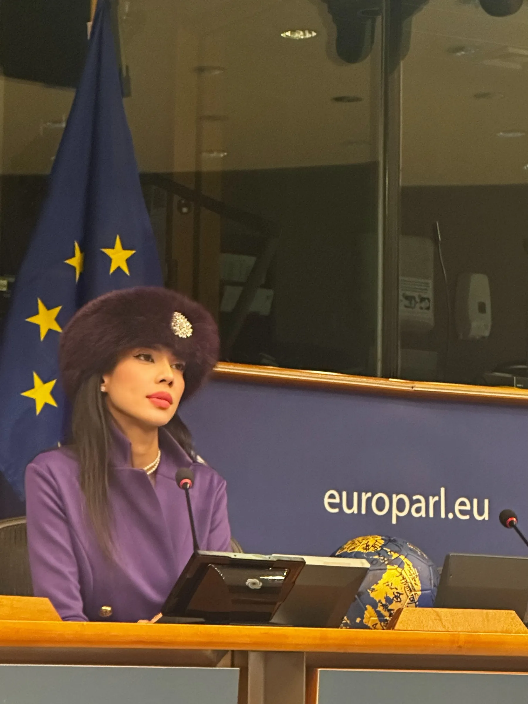 Rani Vanouska T. Modely seated at a conference desk